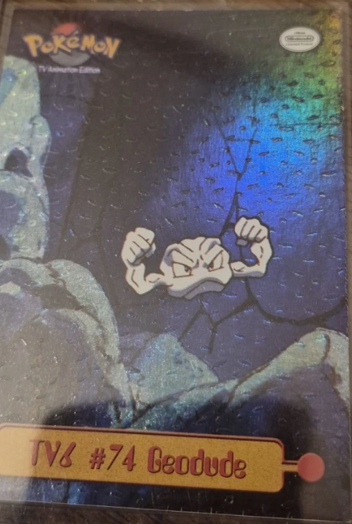 Geodude #TV6 4th Print - Black Logo · Dents Rainbow Foil – 1999 Topps Pokemon TV Animation Series 1 Pokémon card