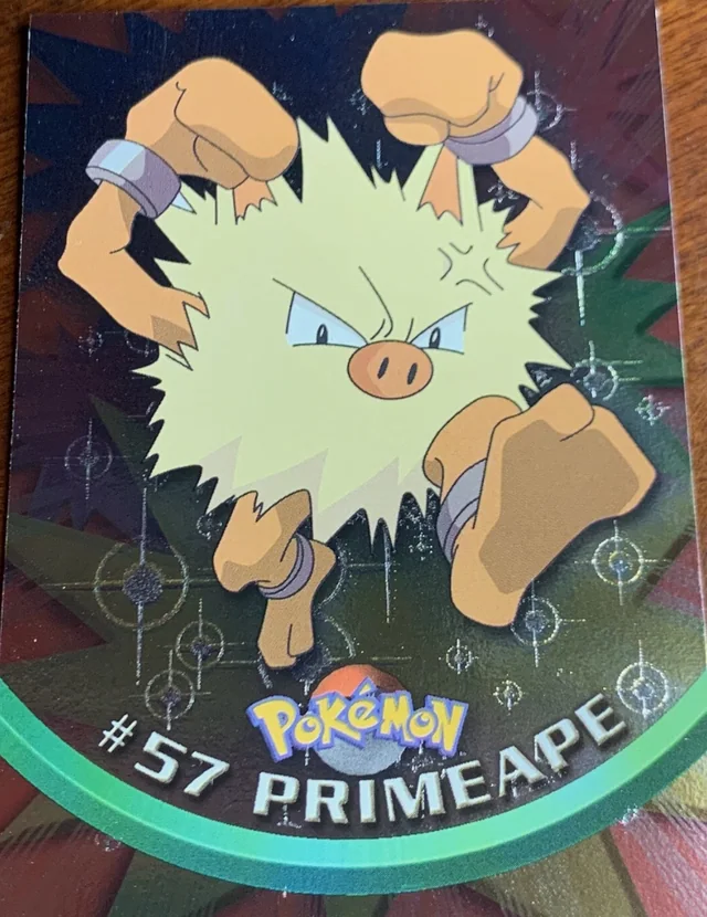 Primeape #57 4th Print - Black Logo · Pokeballs Silver Foil – 1999 Topps Pokemon TV Animation Series 1 Pokémon card